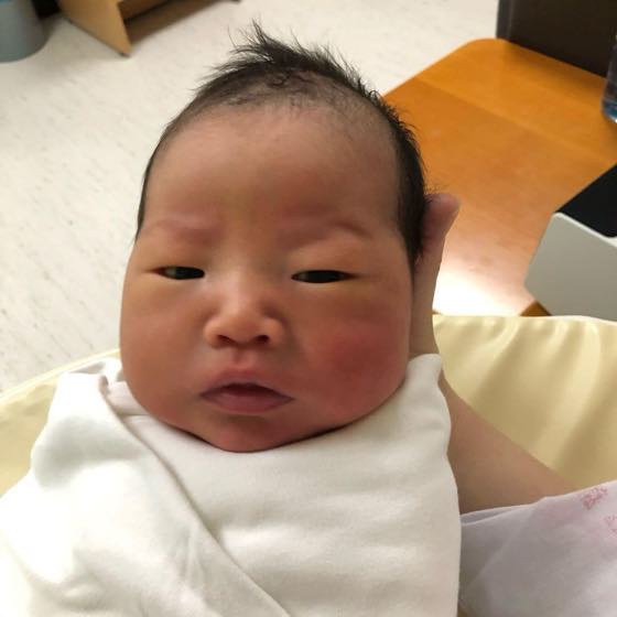 A parent observing the state of a grunting newborn